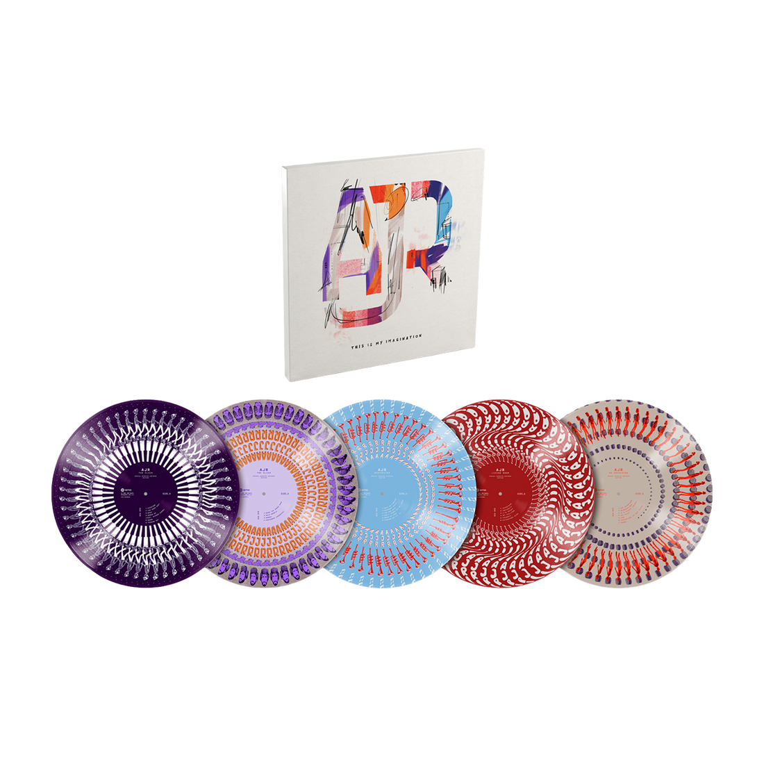 A set of five decorative plates with intricate circular patterns in purple, orange, blue, red, and white, displayed in front of a white book or album cover featuring a colorful abstract letter &