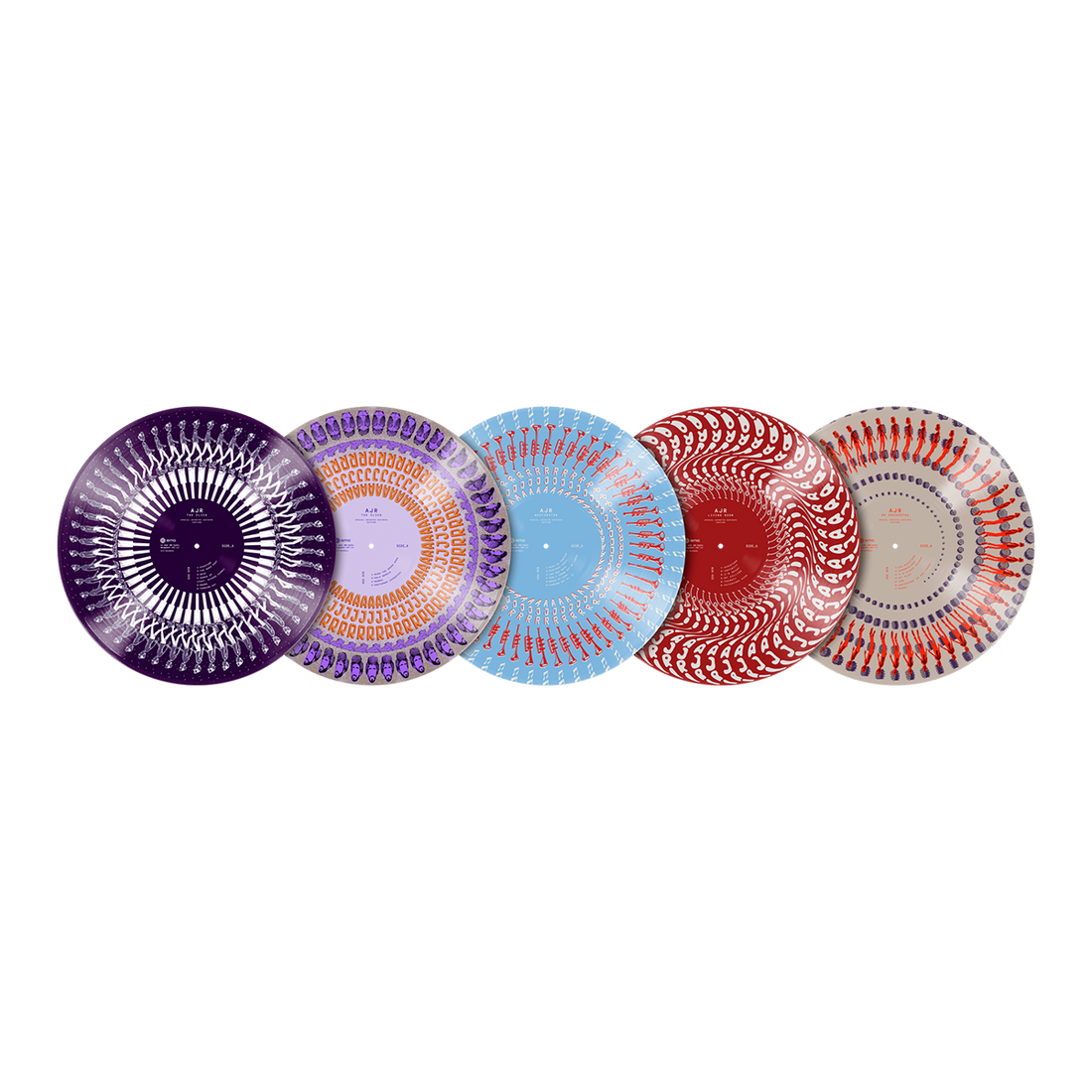 Five decorative round plates with intricate radial patterns are lined up horizontally on a solid white background. The plates feature different colorways: purple, lavender/orange, light blue, red, and red/orange/gray on white.